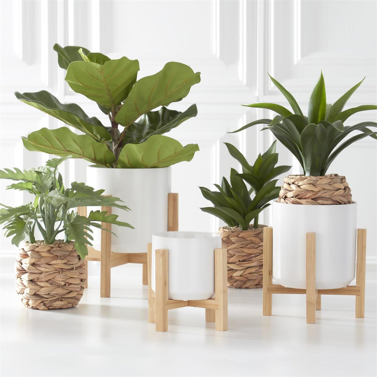 FOLIAGE IN WOVEN ROUND BASKETS